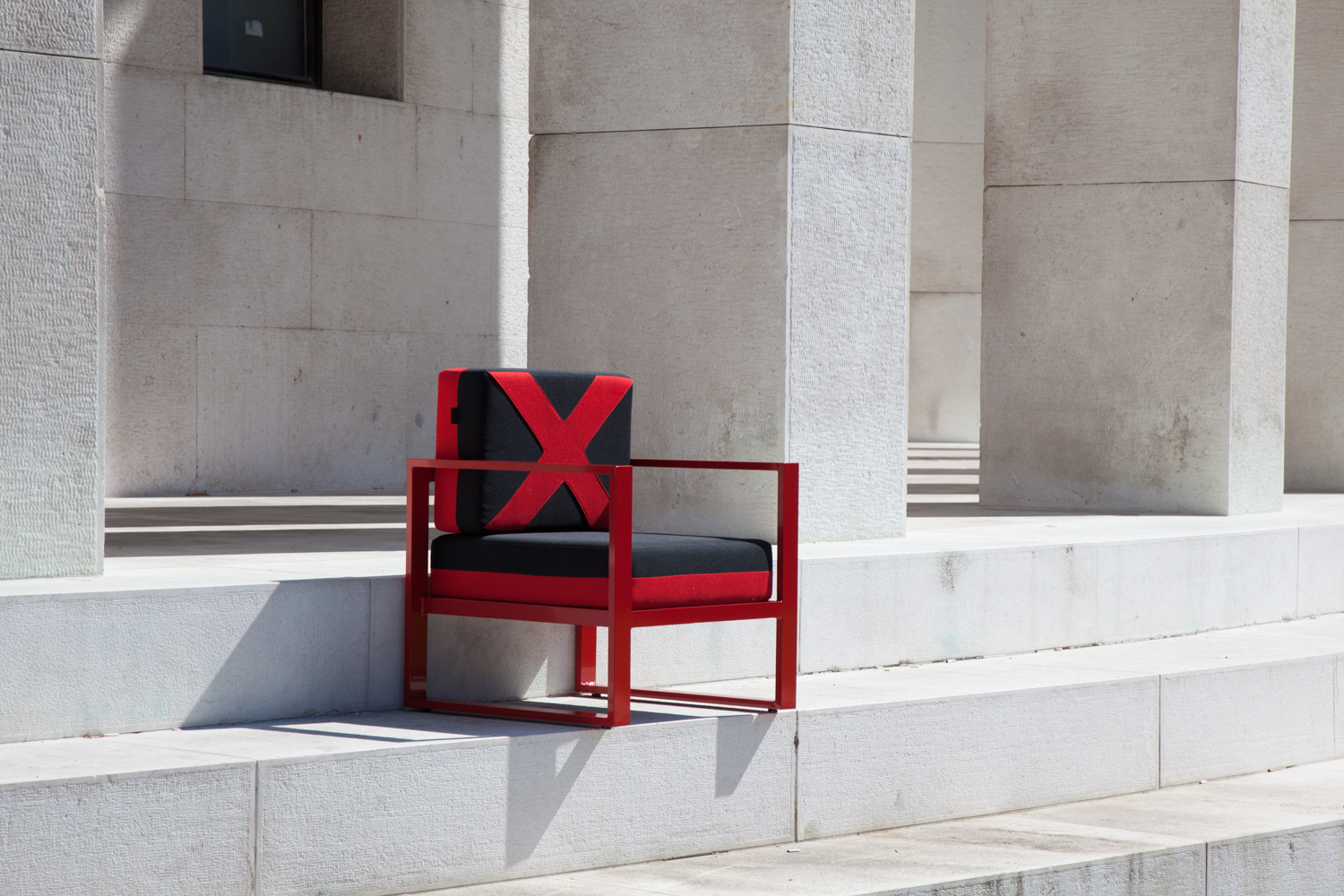X Armchair Red at stairs of Croatian Association of Artists
