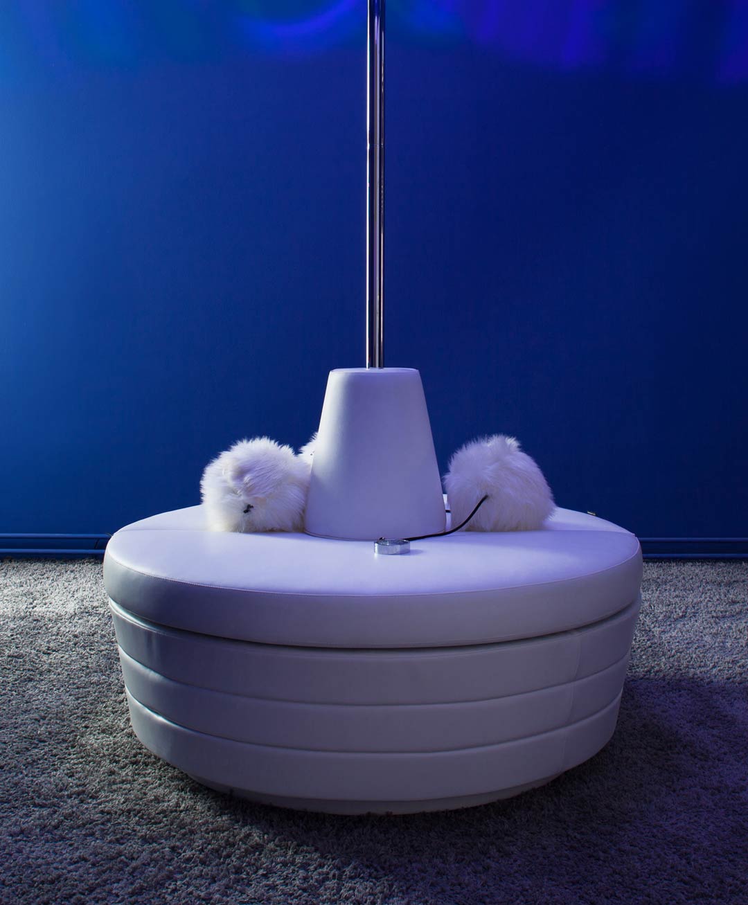 Coquette Odette white leather sette and glass gogo dance stage with strip pole